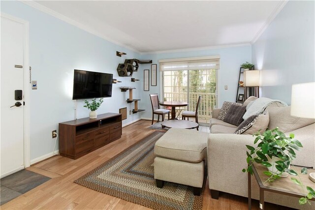 living room featuring ornamental molding and hardwood / wood-style floors