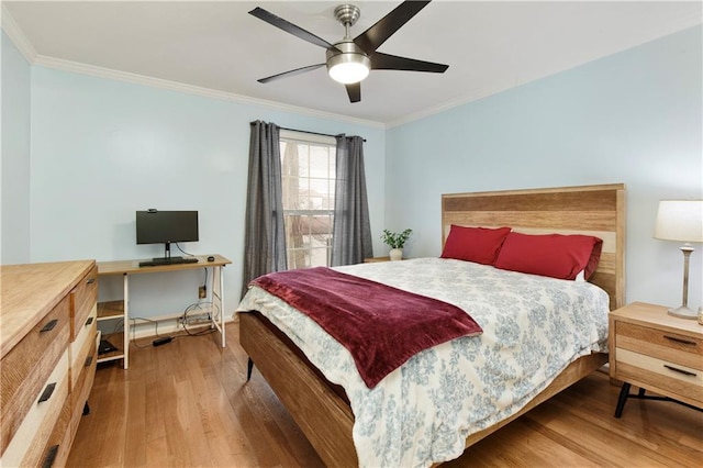 bedroom featuring crown molding, ceiling fan, and wood-type flooring