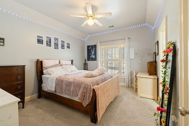 bedroom with visible vents, baseboards, a ceiling fan, and light colored carpet