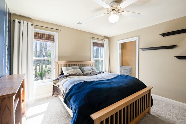 bedroom with carpet, visible vents, baseboards, and a ceiling fan