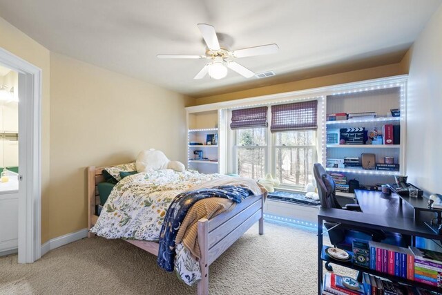 carpeted bedroom featuring visible vents and a ceiling fan