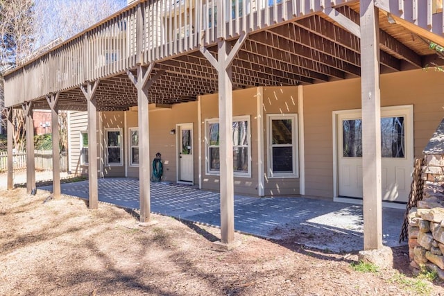 547 Sterling Water Dr, Monroe, GA 30655 - back of property featuring a deck and a patio area