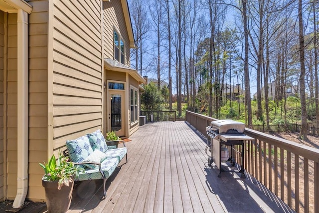 wooden deck featuring area for grilling