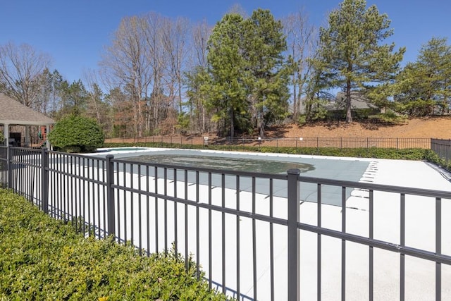 view of pool with a patio area, fence, and a fenced in pool