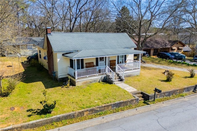 view of front of house featuring a porch and a front yard