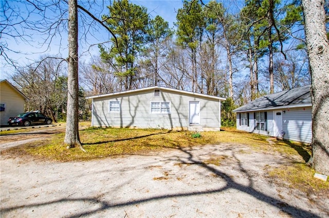 view of property exterior featuring driveway