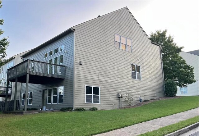 view of side of home with a lawn