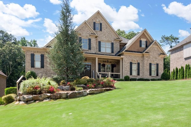 craftsman inspired home with a front yard