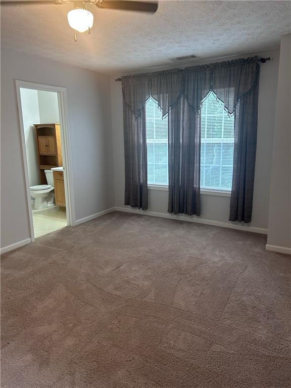 5425 Village Green Sq, Norcross, GA 30093 - carpeted spare room featuring baseboards, a textured ceiling, and a ceiling fan