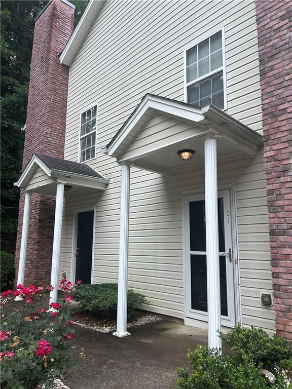 5425 Village Green Sq, Norcross, GA 30093 - doorway to property with a chimney