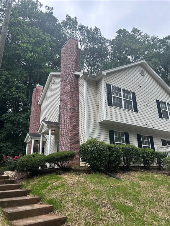 5425 Village Green Sq, Norcross, GA 30093 - view of side of property featuring a chimney