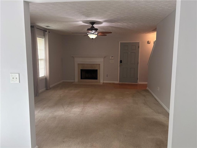 5425 Village Green Sq, Norcross, GA 30093 - unfurnished living room featuring ceiling fan, a textured ceiling, light colored carpet, a fireplace, and baseboards