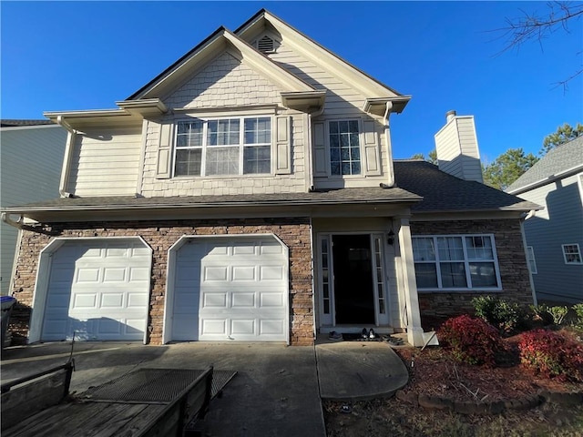 view of front of home with a garage