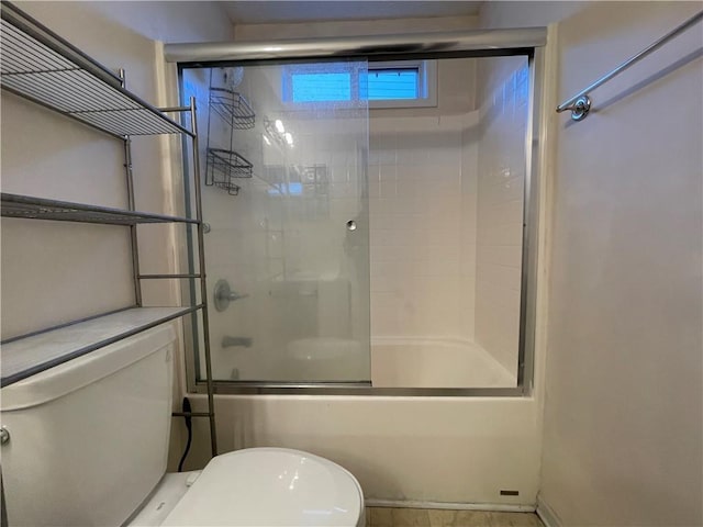 bathroom with toilet and enclosed tub / shower combo