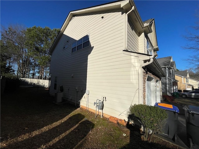 view of home's exterior featuring central AC unit