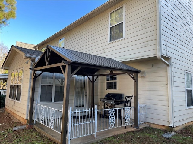 rear view of house with a gazebo