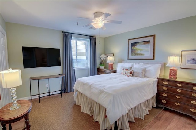 bedroom with ceiling fan and light hardwood / wood-style floors