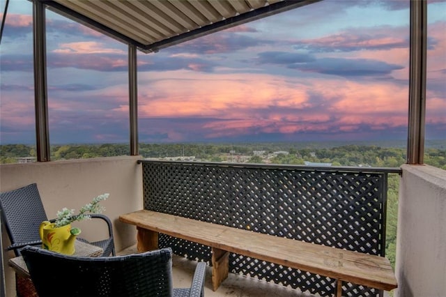 view of balcony at dusk