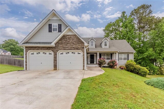 51 Legend Creek Way, Douglasville, GA 30134 - view of front of home featuring fence, covered porch, concrete driveway, and a front lawn