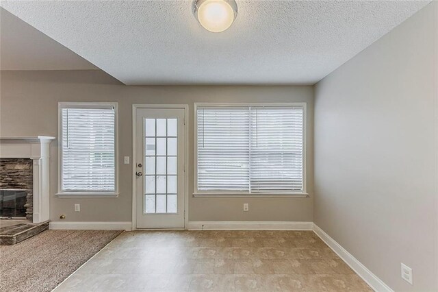 51 Legend Creek Way, Douglasville, GA 30134 - unfurnished dining area with crown molding, a notable chandelier, a textured ceiling, and light colored carpet