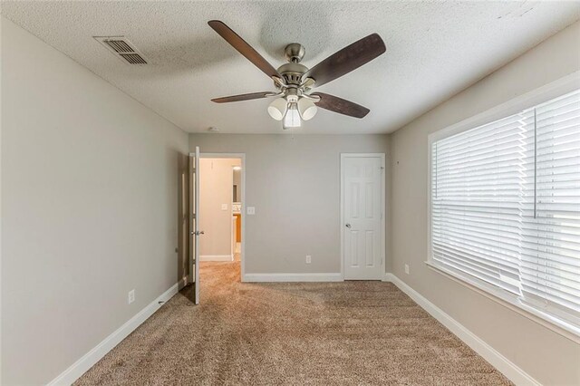 51 Legend Creek Way, Douglasville, GA 30134 - unfurnished bedroom featuring carpet flooring, a textured ceiling, baseboards, visible vents, and a closet
