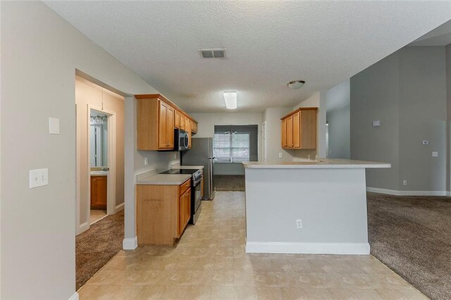 51 Legend Creek Way, Douglasville, GA 30134 - kitchen featuring a textured ceiling, visible vents, black electric range, light countertops, and stainless steel microwave