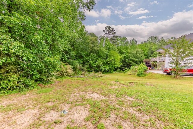 51 Legend Creek Way, Douglasville, GA 30134 - living area with a healthy amount of sunlight, high vaulted ceiling, baseboards, and visible vents