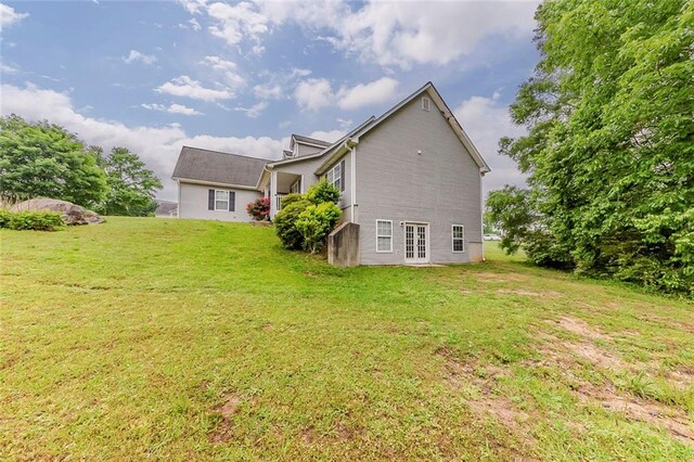 51 Legend Creek Way, Douglasville, GA 30134 - living area with a ceiling fan, light colored carpet, visible vents, a fireplace, and high vaulted ceiling