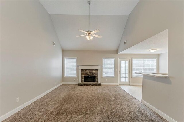 51 Legend Creek Way, Douglasville, GA 30134 - unfurnished living room featuring light colored carpet, baseboards, a wealth of natural light, and high vaulted ceiling
