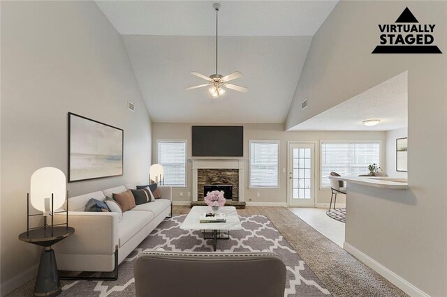 51 Legend Creek Way, Douglasville, GA 30134 - unfurnished living room featuring visible vents, a stone fireplace, light carpet, and high vaulted ceiling