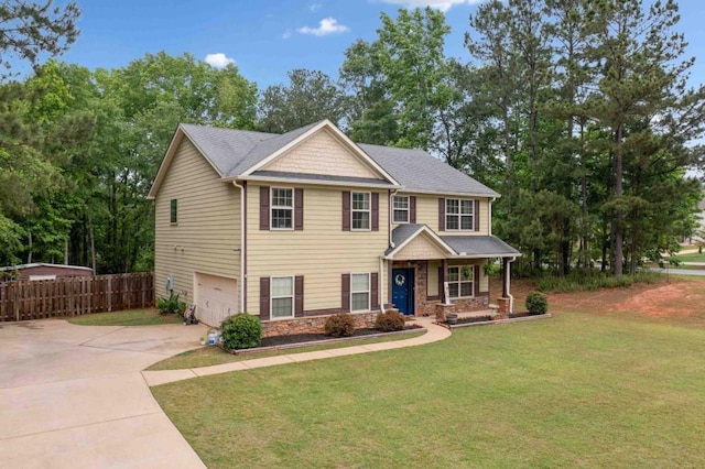 14 Oak Leaf Way, Hamilton, GA 31811 - craftsman house with concrete driveway, an attached garage, covered porch, stone siding, and view of wooded area