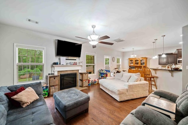 14 Oak Leaf Way, Hamilton, GA 31811 - living area with a ceiling fan, healthy amount of natural light, wood finished floors, and a fireplace with flush hearth