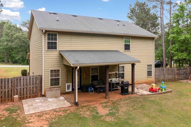 14 Oak Leaf Way, Hamilton, GA 31811 - back of house featuring a patio, a fenced backyard, and a shingled roof