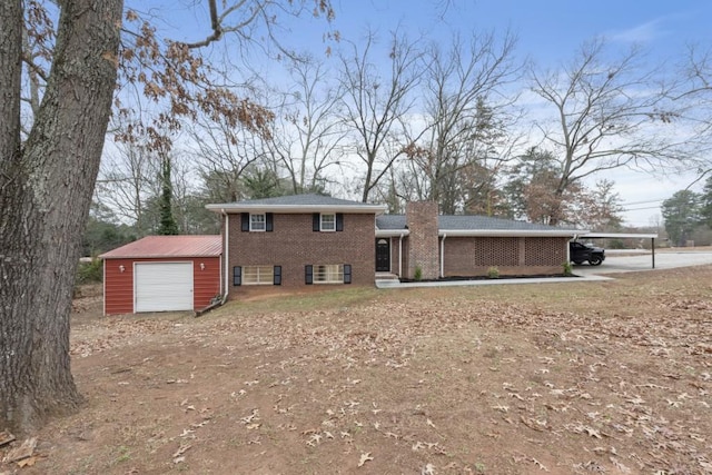 split level home featuring an outbuilding, a garage, and a carport