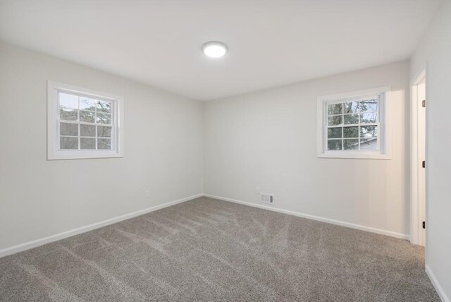 empty room with carpet flooring