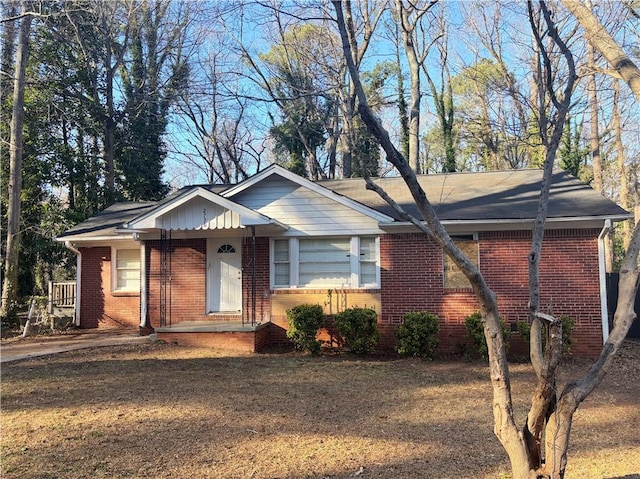 ranch-style home featuring brick siding