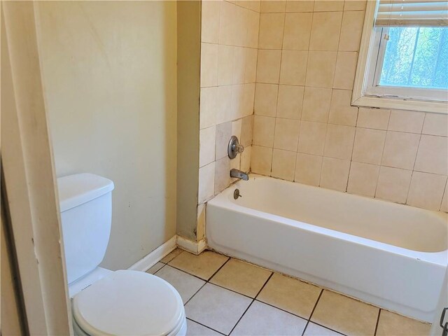 full bath with toilet, baseboards, a shower, tile patterned floors, and a bathtub