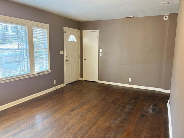 entryway featuring wood-type flooring, visible vents, and baseboards