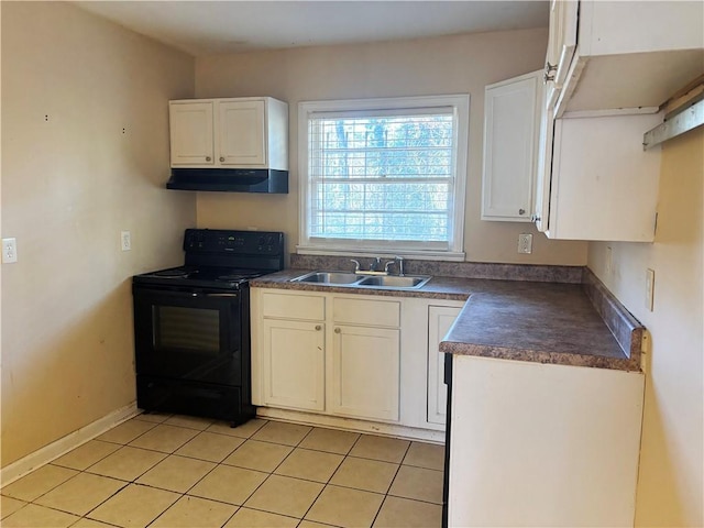 kitchen featuring light tile patterned floors, under cabinet range hood, electric range, a sink, and dark countertops