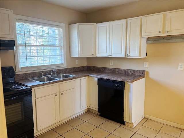 kitchen with dark countertops, white cabinets, a sink, under cabinet range hood, and black appliances