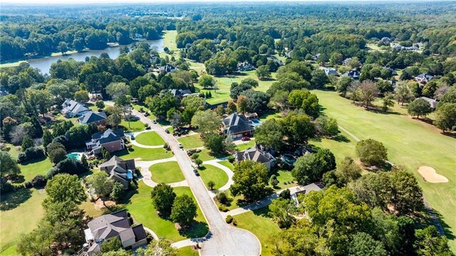 aerial perspective of suburban area featuring a large body of water and a local golf course