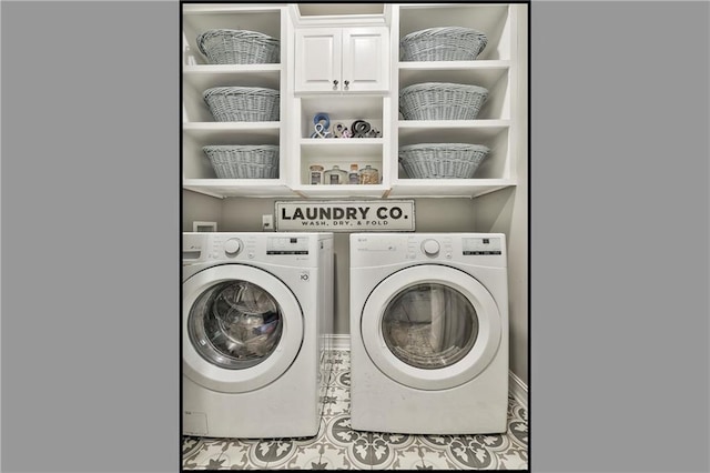 laundry area with cabinet space, separate washer and dryer, and tile patterned flooring