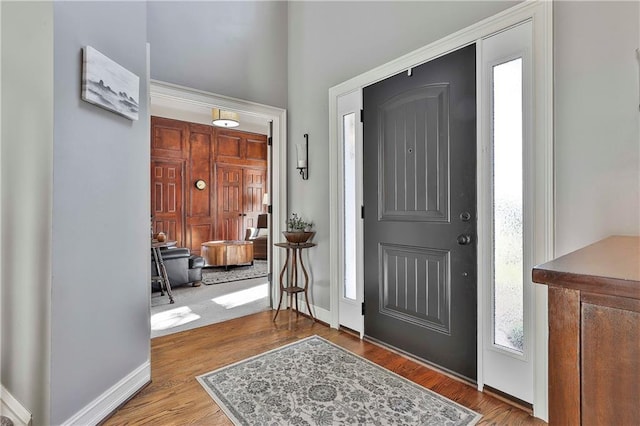 entrance foyer with wood finished floors and baseboards