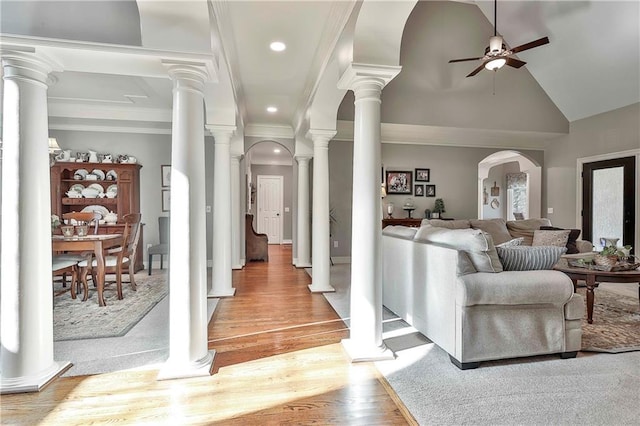 living room featuring ceiling fan, light wood-style flooring, recessed lighting, crown molding, and high vaulted ceiling