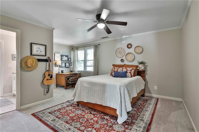 bedroom with light colored carpet, crown molding, baseboards, ceiling fan, and an office area