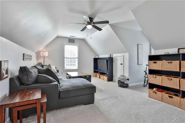 living room featuring lofted ceiling, carpet, a ceiling fan, and baseboards