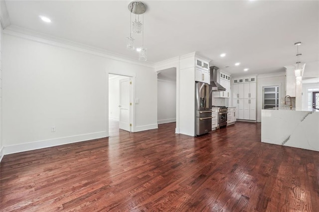 unfurnished living room with crown molding, dark hardwood / wood-style flooring, and sink