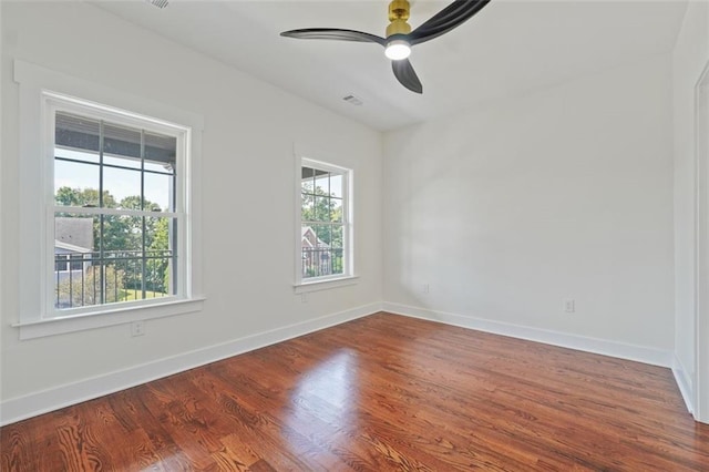 empty room with ceiling fan and wood-type flooring