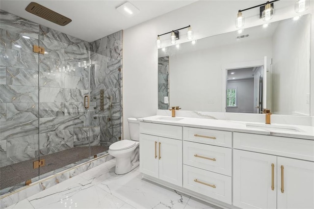 bathroom featuring vanity, toilet, and an enclosed shower