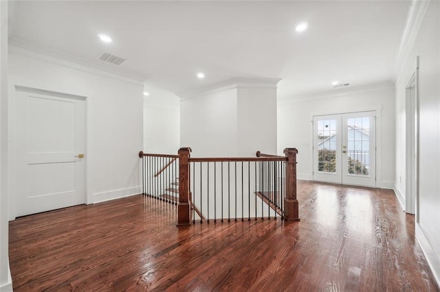 interior space featuring crown molding, dark hardwood / wood-style floors, and french doors